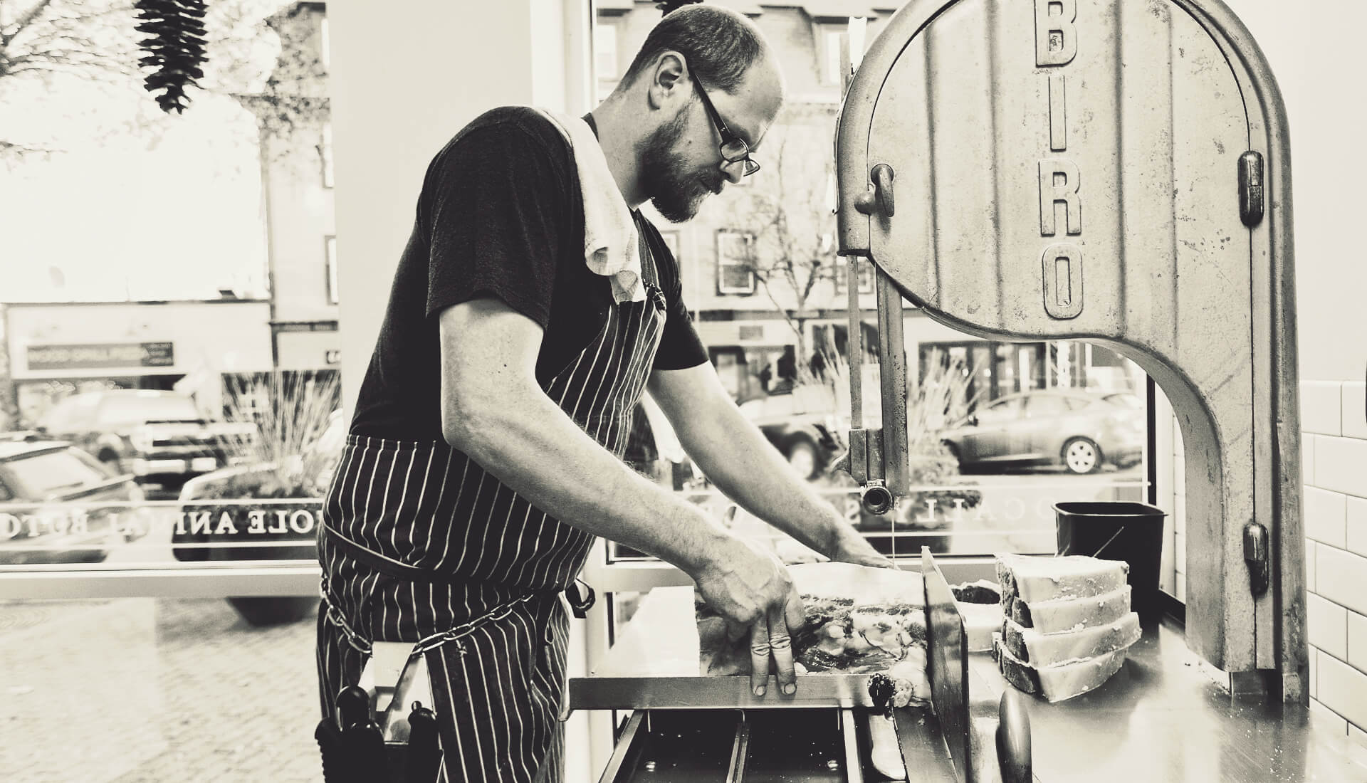 Jarrod Spangler cutting dry aged beef steaks